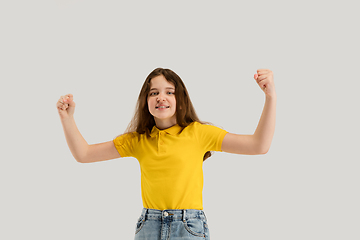 Image showing Caucasian girl isolated on white studio background. Copyspace. Childhood, education, emotions concept