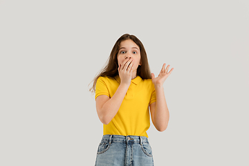 Image showing Caucasian girl isolated on white studio background. Copyspace. Childhood, education, emotions concept