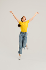 Image showing Caucasian girl isolated on white studio background. Copyspace. Childhood, education, emotions concept