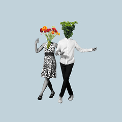 Image showing Contemporary art collage, modern design. Retro style. Couple of dancers headed with flowers and plants on blue pastel background.