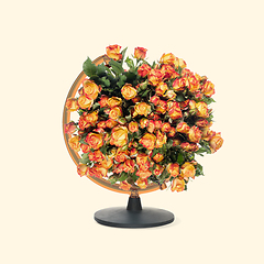 Image showing Contemporary art collage, modern design. Retro style. Globe with bouquet with blooming spring flowers on pastel background