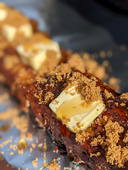 Image showing Close-up view of delicious juicy meat with ribs on grill