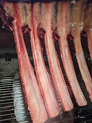 Image showing Dry aged beef steaks - ribeye, striploin, t-bone steaks on Black