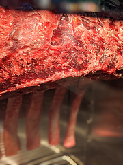 Image showing Dry aged beef steaks - ribeye, striploin, t-bone steaks on Black