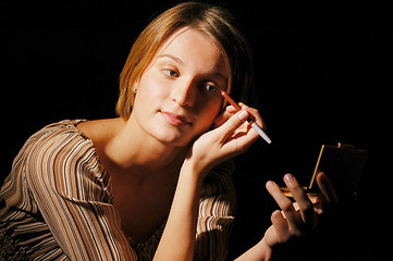 Image showing Girl making-up