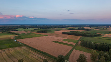 Image showing Sunset aerial landscape of filds and meadows