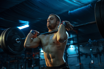 Image showing Caucasian man practicing in weightlifting in gym