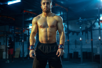 Image showing Caucasian man practicing in weightlifting in gym