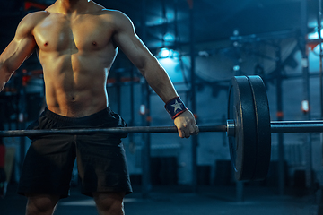 Image showing Caucasian man practicing in weightlifting in gym