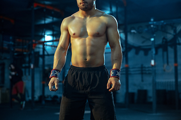 Image showing Caucasian man practicing in weightlifting in gym