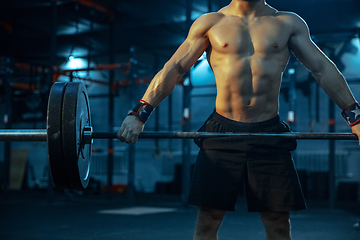 Image showing Caucasian man practicing in weightlifting in gym