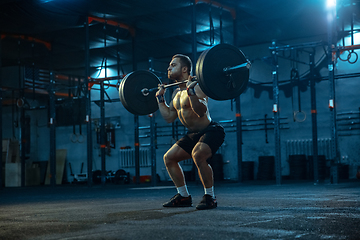 Image showing Caucasian man practicing in weightlifting in gym