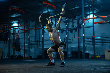 Image showing Caucasian man practicing in weightlifting in gym