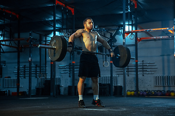 Image showing Caucasian man practicing in weightlifting in gym