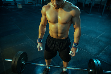 Image showing Caucasian man practicing in weightlifting in gym