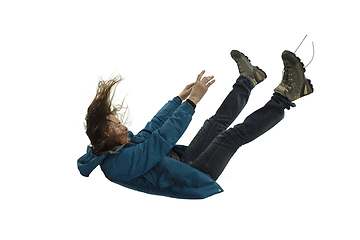 Image showing A second before falling - young man falling down with bright emotions and expression