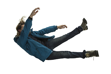 Image showing A second before falling - young man falling down with bright emotions and expression