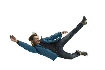 Image showing A second before falling - young man falling down with bright emotions and expression