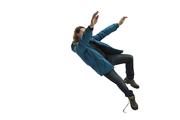 Image showing A second before falling - young man falling down with bright emotions and expression