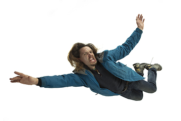 Image showing A second before falling - young man falling down with bright emotions and expression