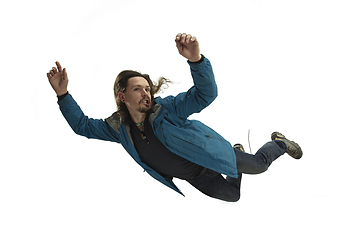 Image showing A second before falling - young man falling down with bright emotions and expression