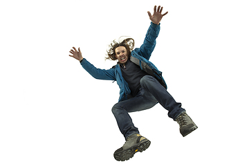 Image showing A second before falling - young man falling down with bright emotions and expression