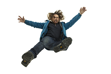 Image showing A second before falling - young man falling down with bright emotions and expression