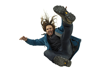 Image showing A second before falling - young man falling down with bright emotions and expression