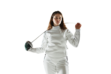 Image showing Teen girl in fencing costume with sword in hand isolated on white background