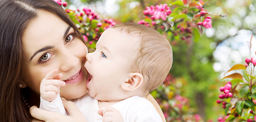 Image showing mother with baby over spring garden background