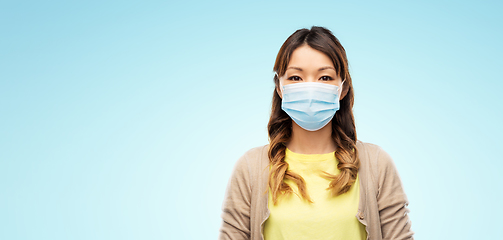 Image showing asian young woman in protective medical mask