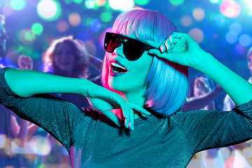 Image showing woman in wig and sunglasses dancing at nightclub