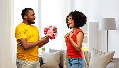 Image showing happy african american couple with flowers