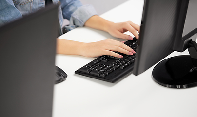 Image showing female hands typing on computer keyboard