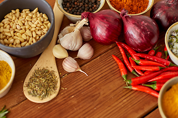 Image showing spices, onion, garlic, pine nuts and chili peppers