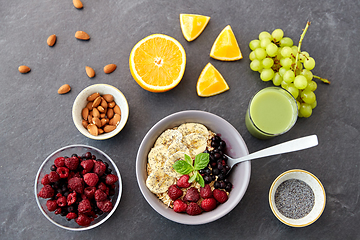 Image showing cereal with berries, fruits and glass of juice