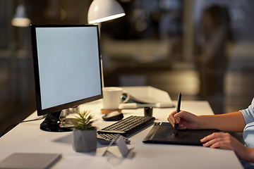 Image showing designer with computer and pen tablet at office