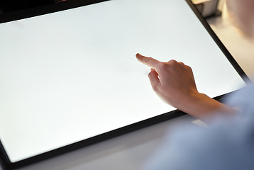 Image showing hand on led light tablet at night office