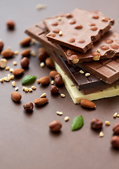 Image showing close up of different chocolate bars and nuts