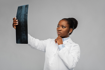 Image showing african american female doctor looking at x-ray