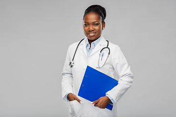 Image showing happy african female doctor with clipboard