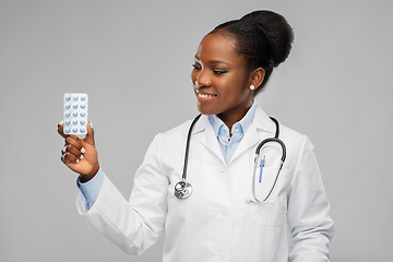 Image showing african american female doctor with medicine pills