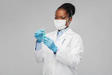 Image showing african american female doctor with syringe