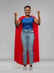 Image showing happy african american woman in red superhero cape