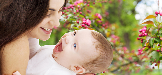 Image showing mother with baby over spring garden background