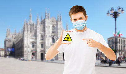 Image showing man in medical mask with coronavirus sign in italy