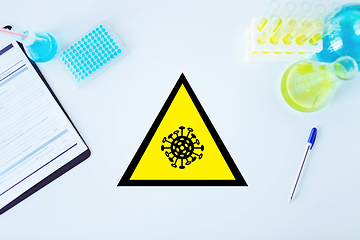 Image showing coronavirus caution sign in scientific laboratory