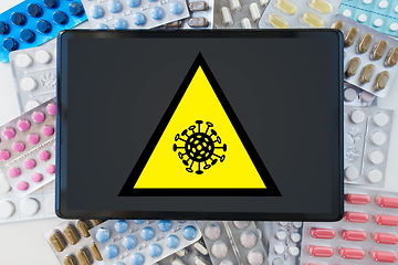 Image showing coronavirus caution sign, tablet pc and drugs