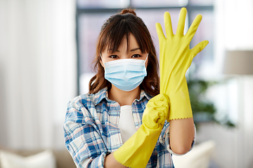 Image showing asian woman in protective mask and rubber gloves