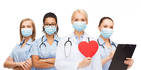 Image showing doctors in protective medical masks with red heart